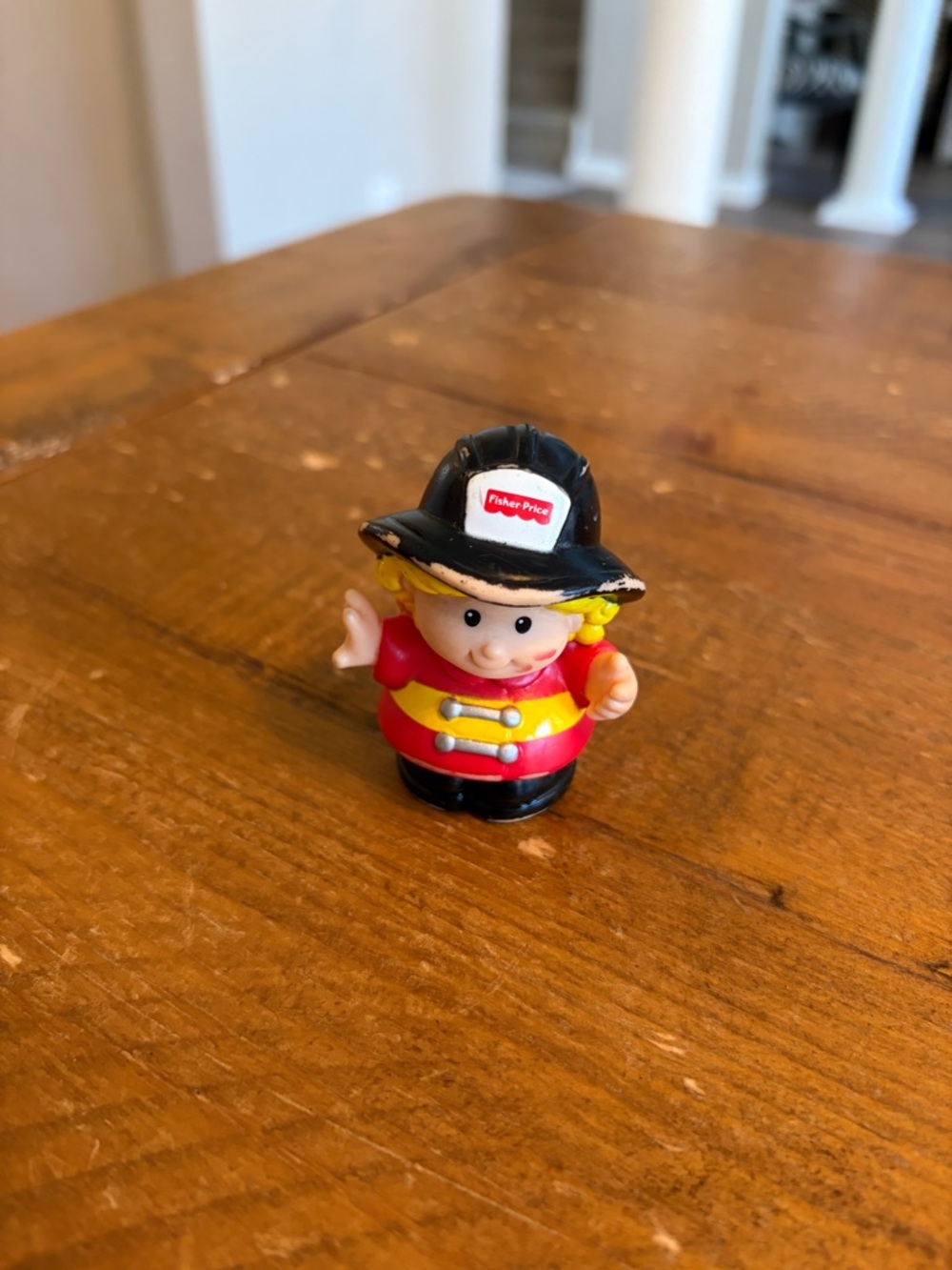 Fisher Price Little People firefighter as is. Has paint wear around hat